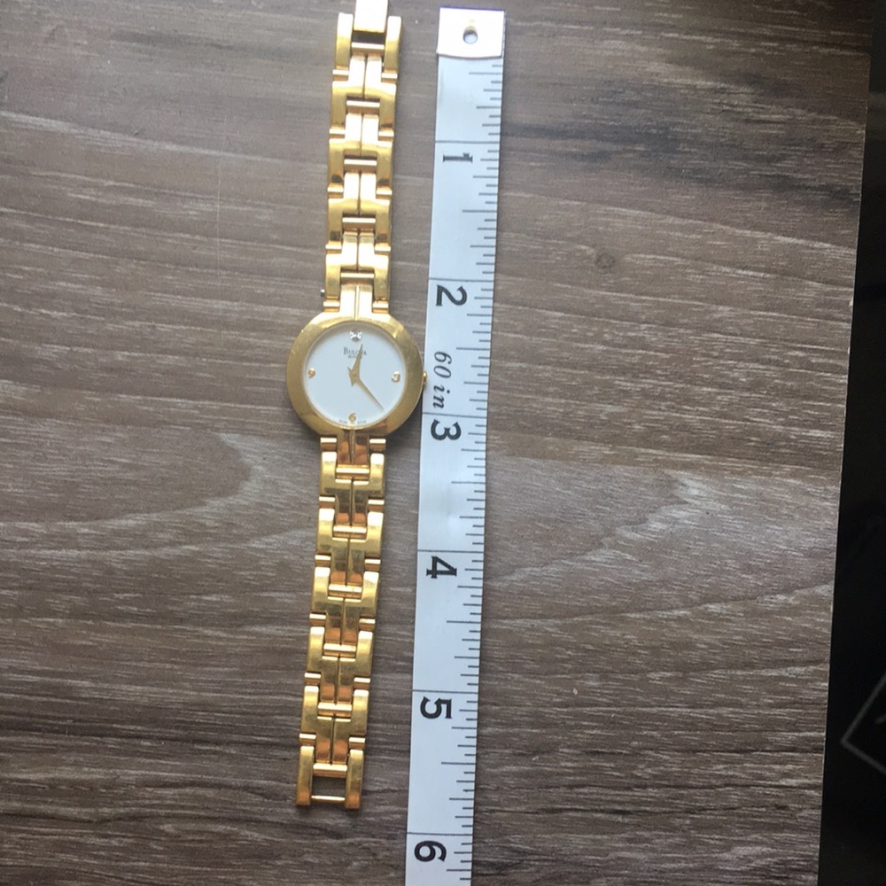 Bulova quartz gold watch.